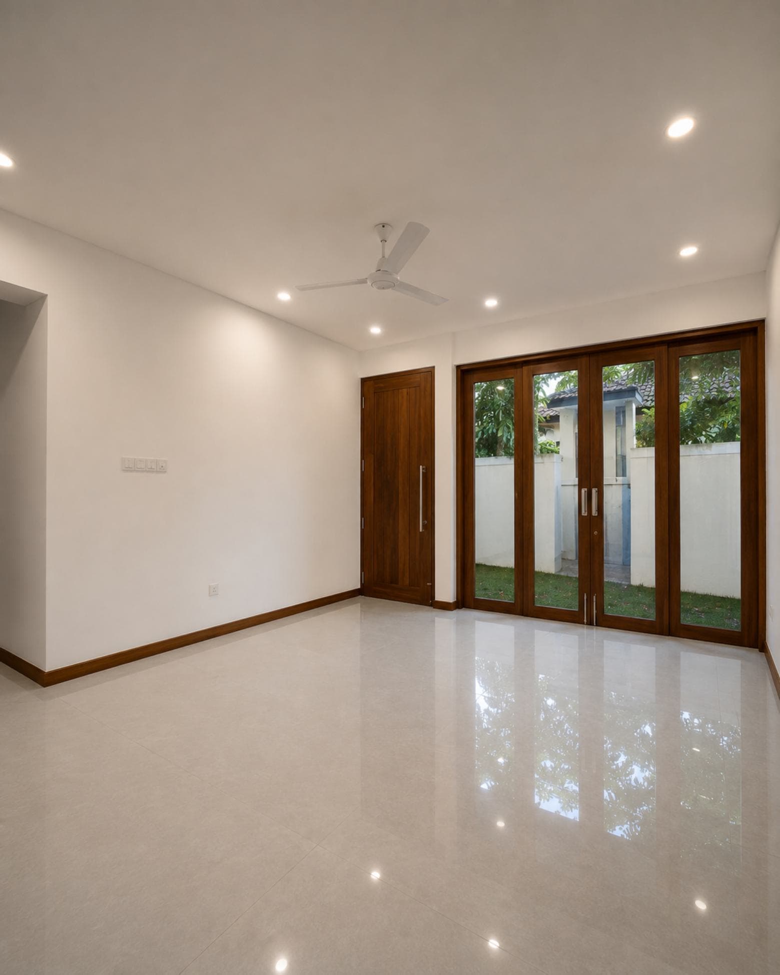 No. 45, Mallikarama Road, Ratmalana — ground-floor room with glazed doors to the side garden